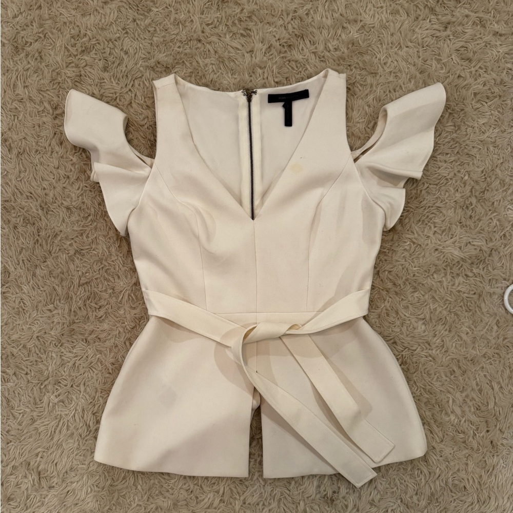 Super cute and flattering BCBG white peplum top, medium.